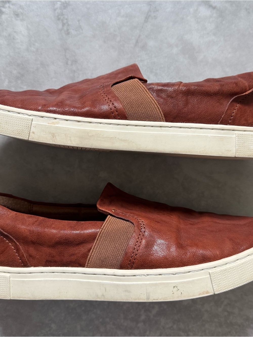 Women's Frye Slip-On Leather Sneakers in Cognac brown leather.